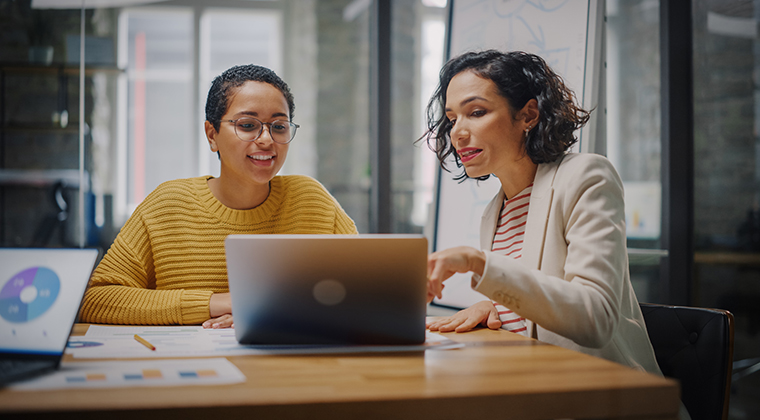 An employee smiles after utilizing a white label applicant tracking system. 