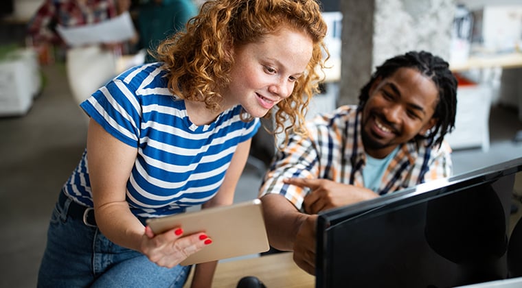 A HiringThing customer smiles after using the AI-Enabled Job Description tool. 