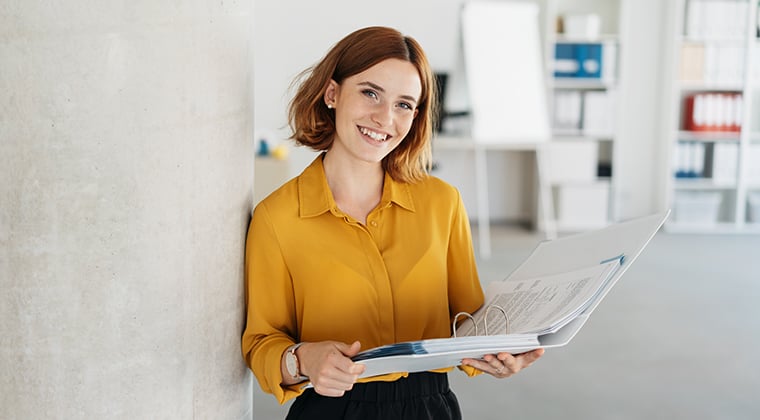 A marketing professional figures out her new product's positioning in her office. 