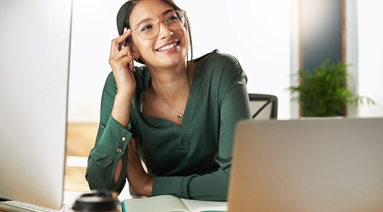 A HiringThing employees smiles at their inclusion on Inc.'s Best Workplaces list. 