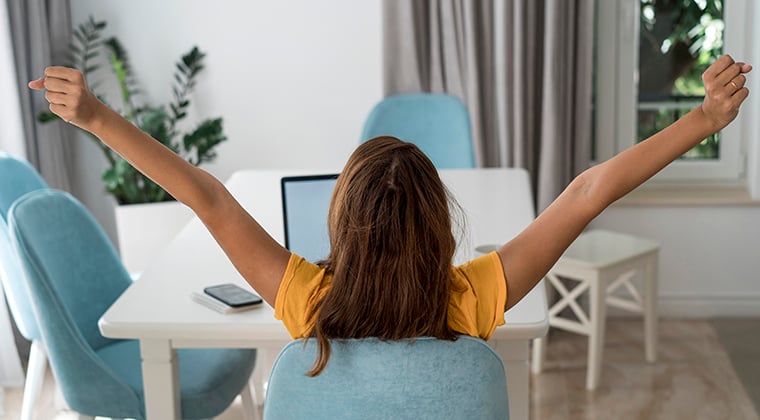 Hiring manager extends arms in relief after successfully posting a job