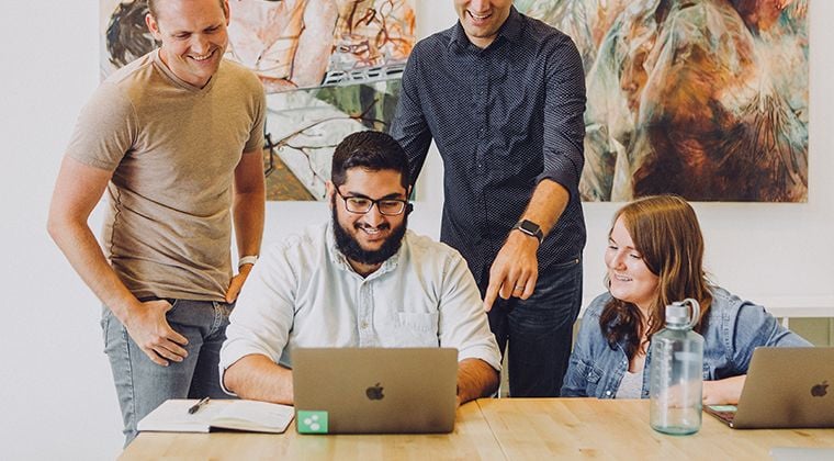 HiringThing employees smile after winning a 2024 BIG Innovation Award. 