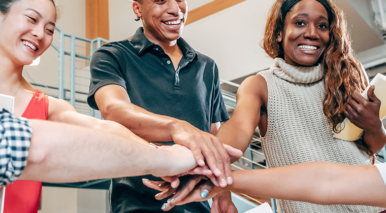 Four colleagues demonstrate the strength of their workplace's employer brand. 