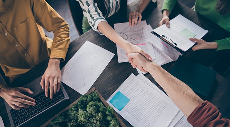 Team hires new employee with shake of the hand