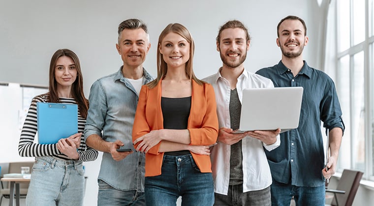 Recruiters standing together with laptop in hand
